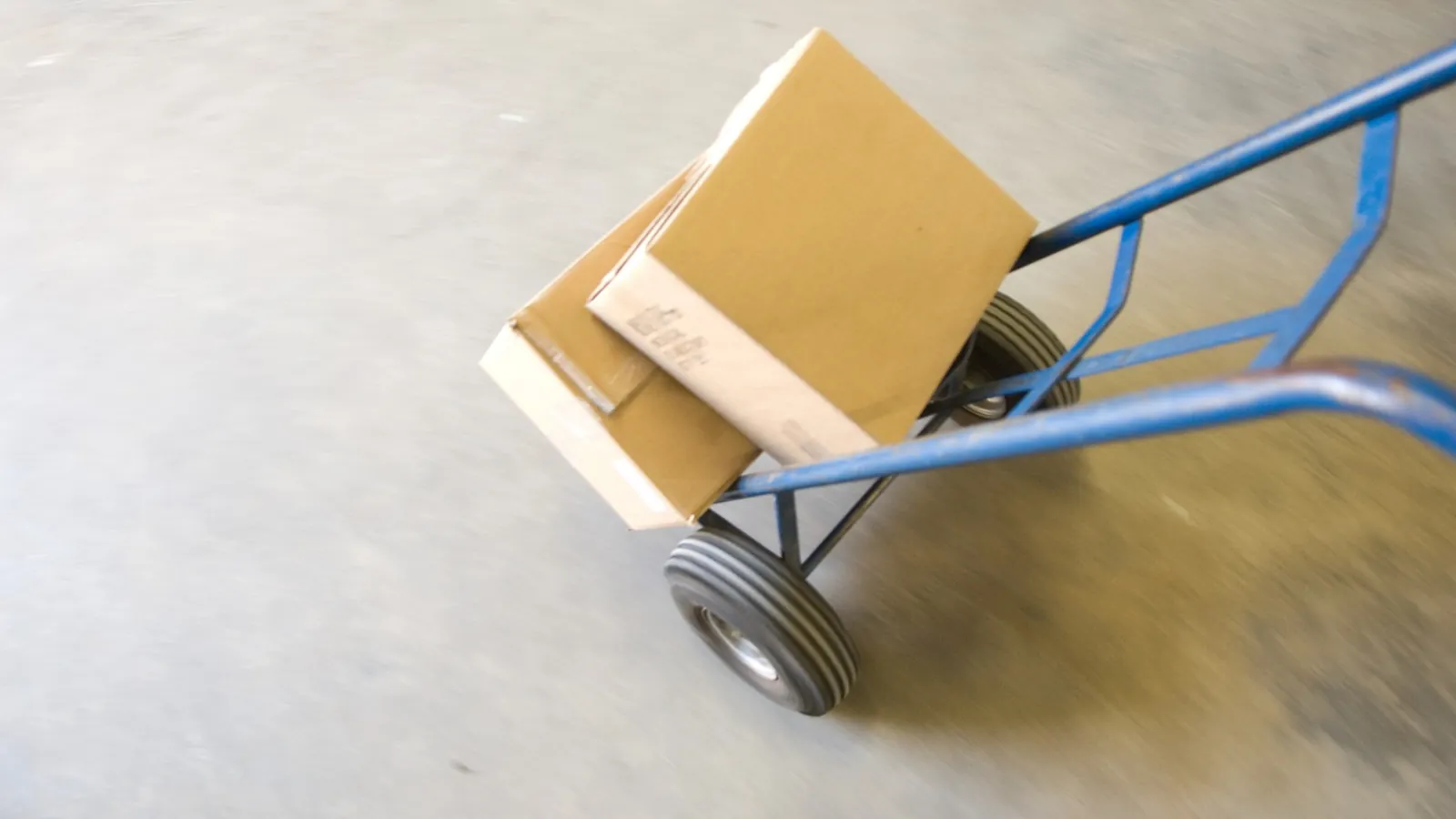 Hand truck carrying moving boxes